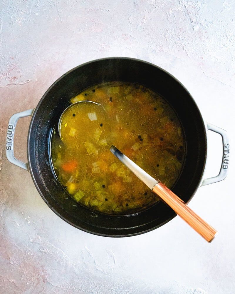 Homemade Vegetable Broth | Veggie broth in a Dutch oven