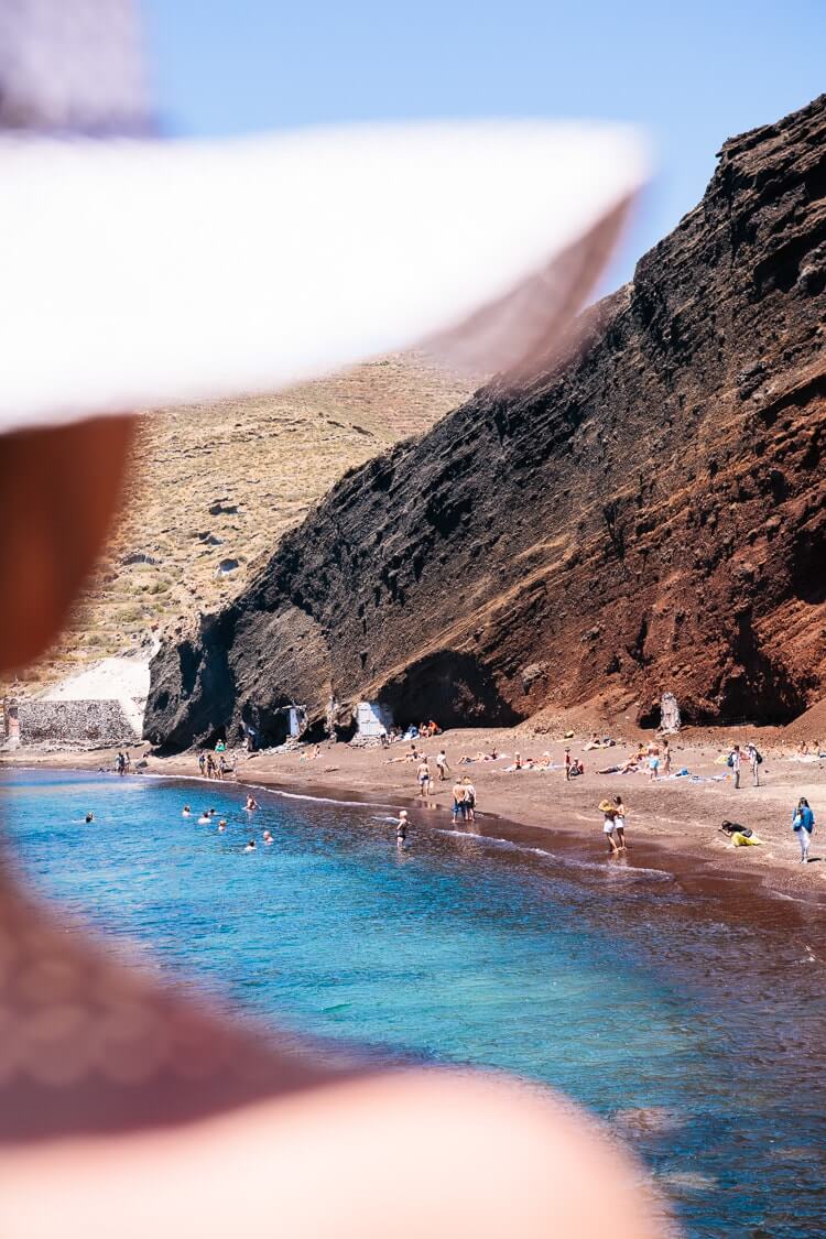 Santorini beaches | The Red Beach | Woman in hat