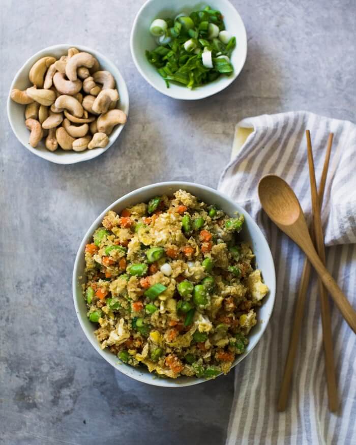 Cauliflower Fried Rice in a bowl with cashews and green onions