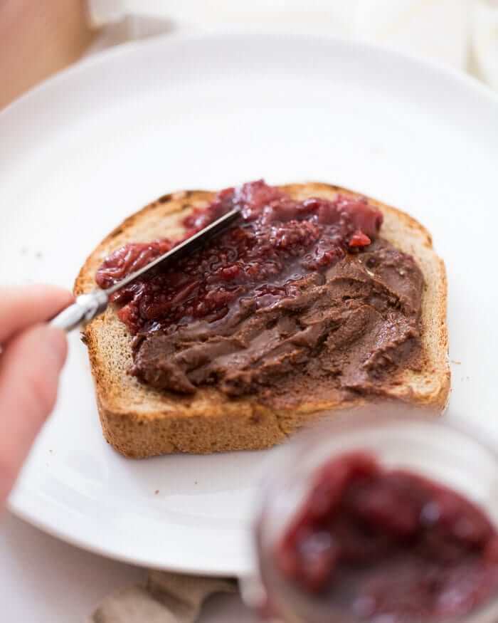 Knife spreading tart cherry jam