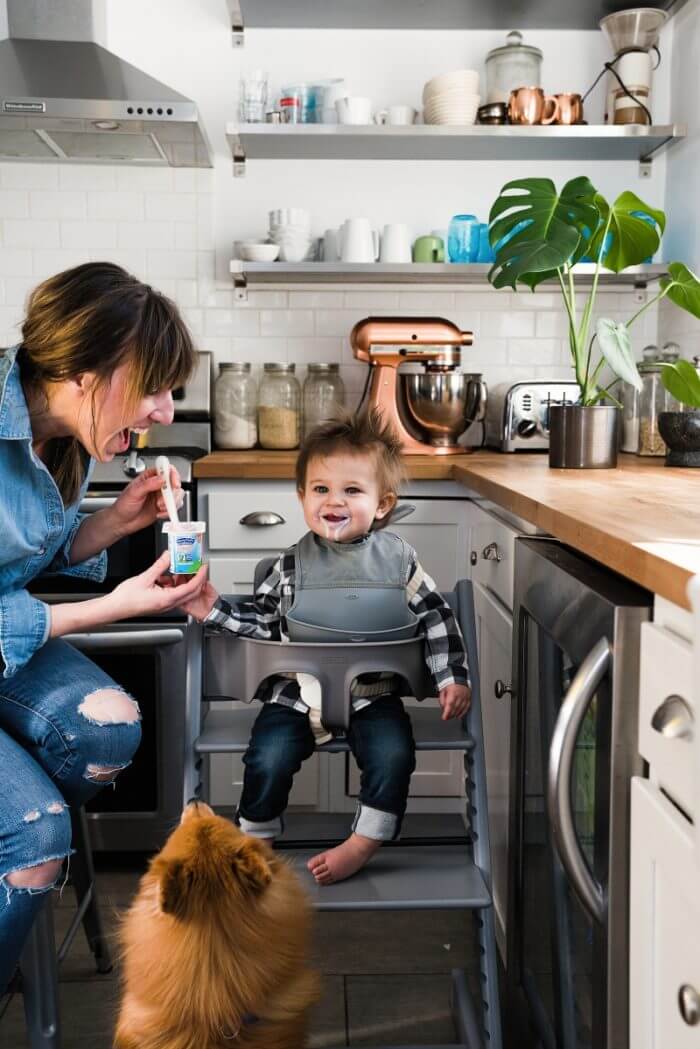 Baby eating in kitchen