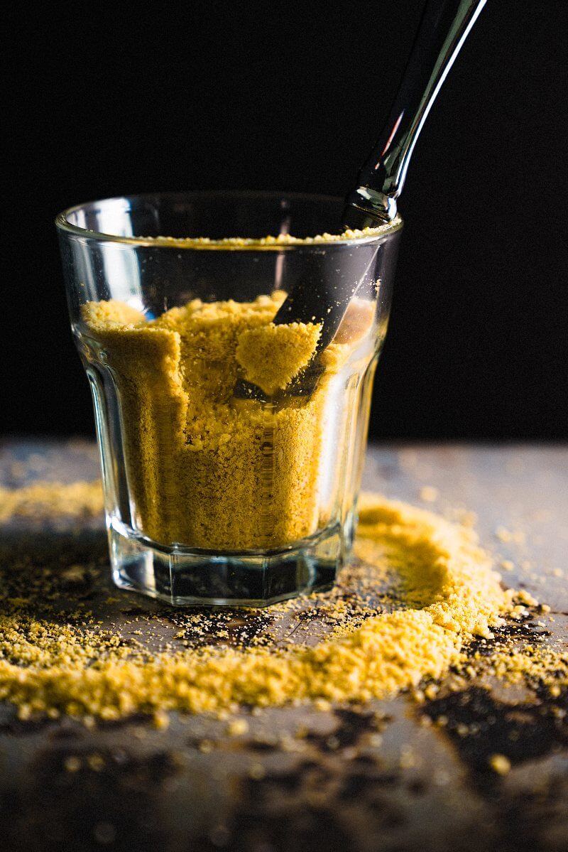 Vegan parmesan cheese in container