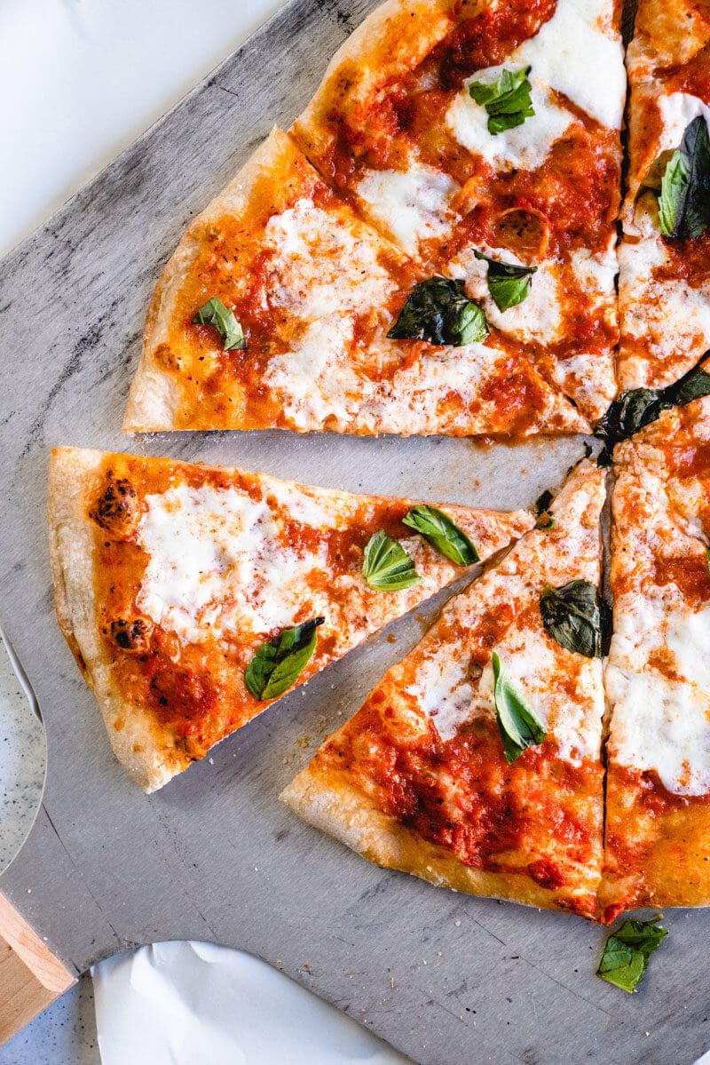 Margherita pizza cooked on pizza stone