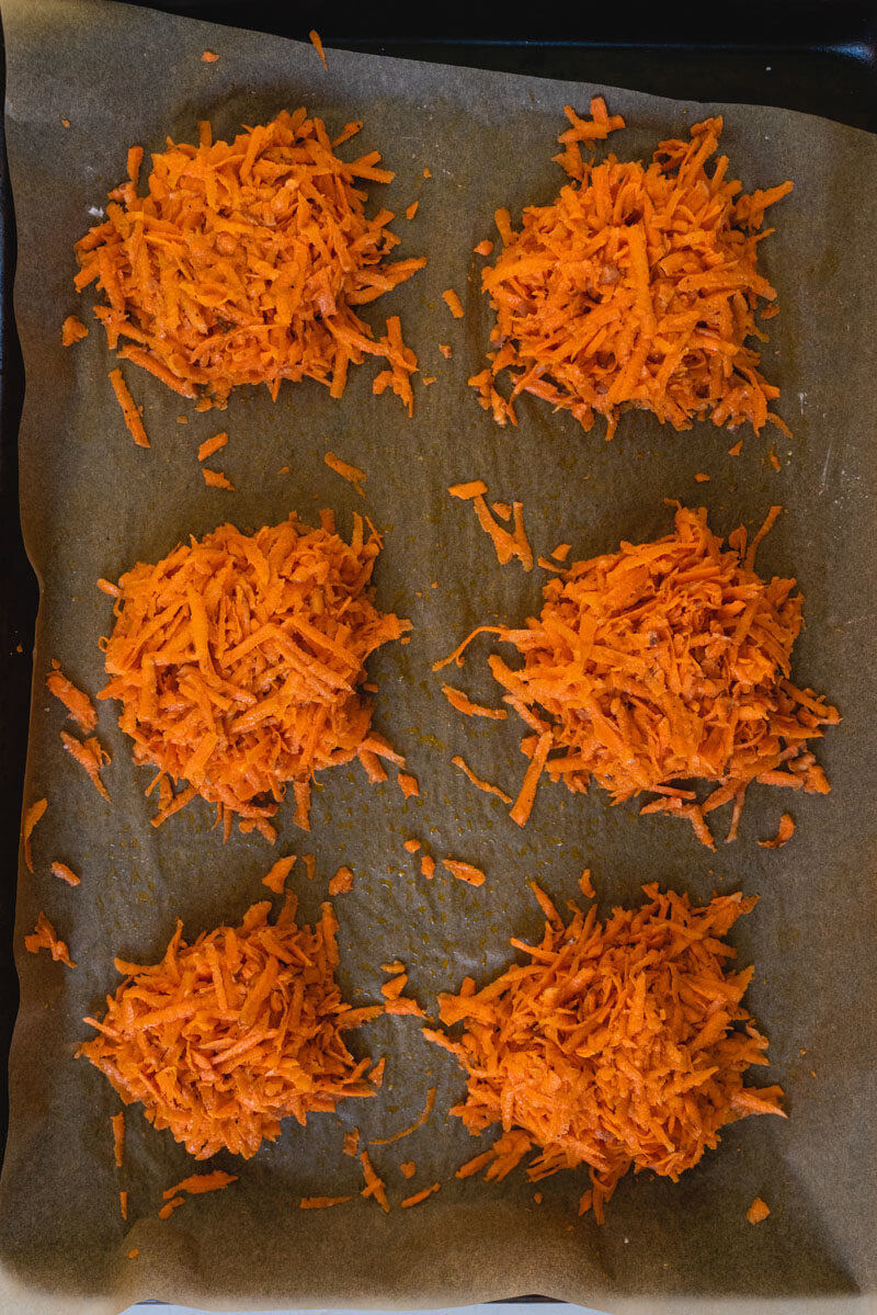 raw sweet potato hash browns on baking sheet