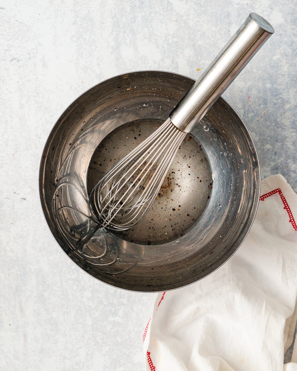 Cucumber salad step 2: Whisk together the vinegar, salt and sugar.
