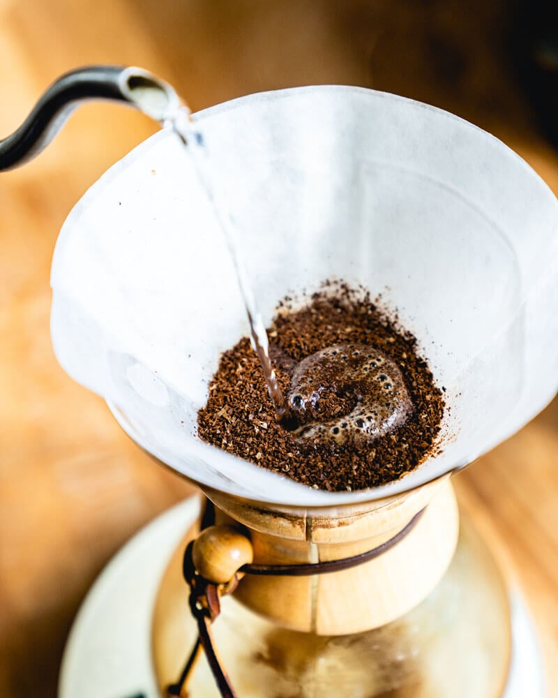 Step 2: Wet the Chemex coffee filter, then wet the coffee and let it bloom.