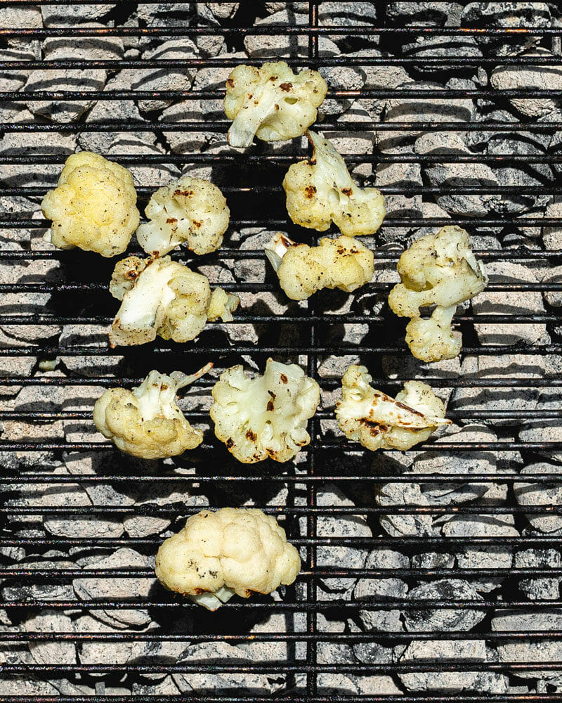 Step 2: Grill the cauliflower directly on the grates. 