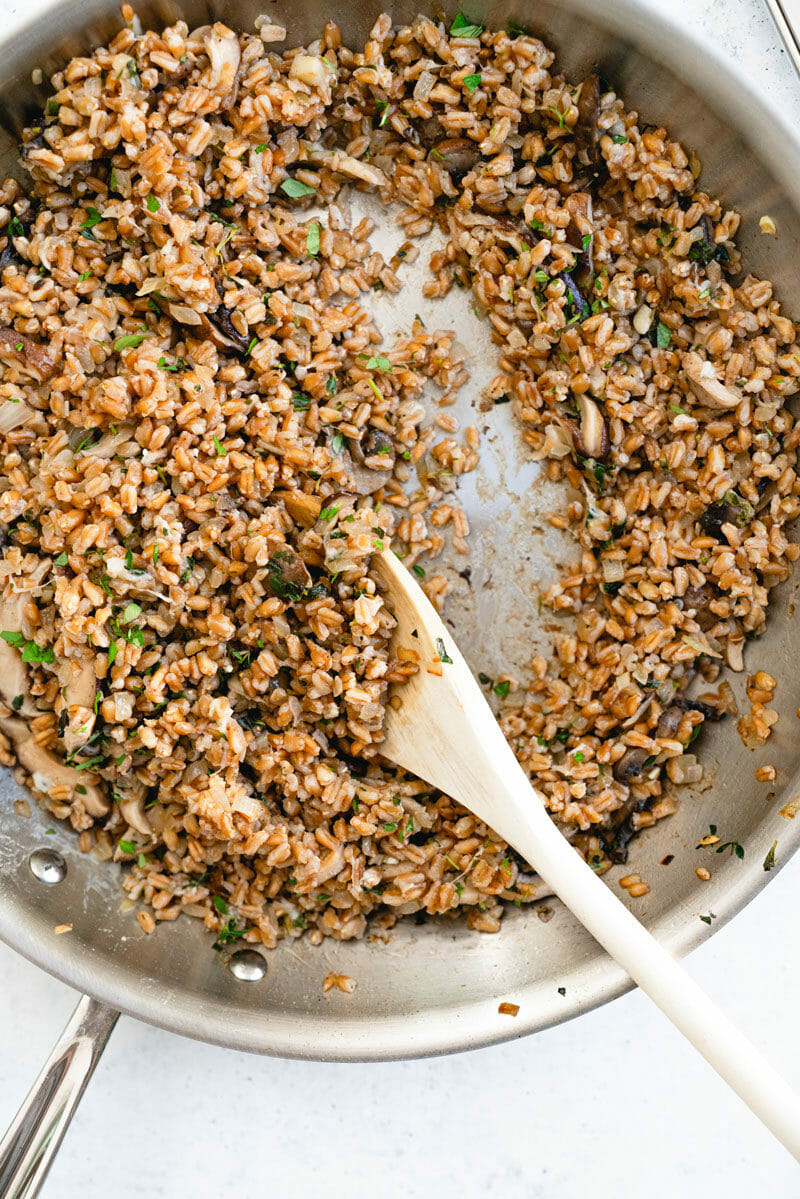 Pan of cooked farro with mushrooms