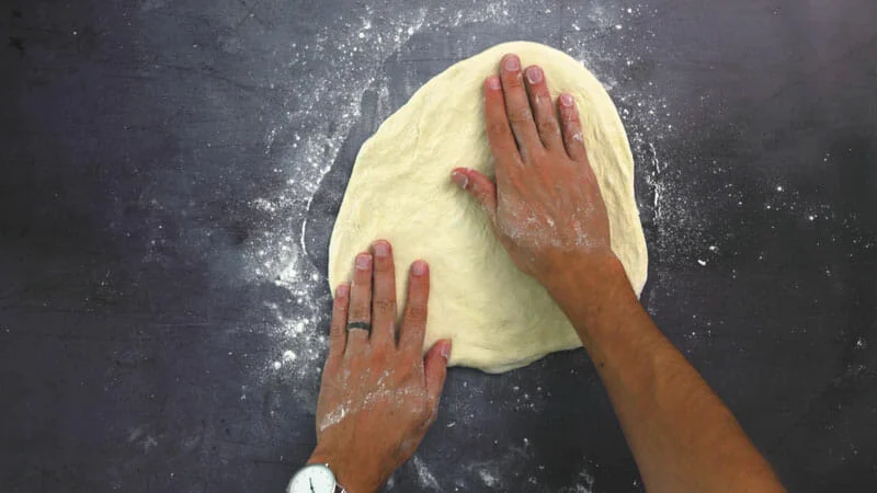 How to stretch pizza dough step 4