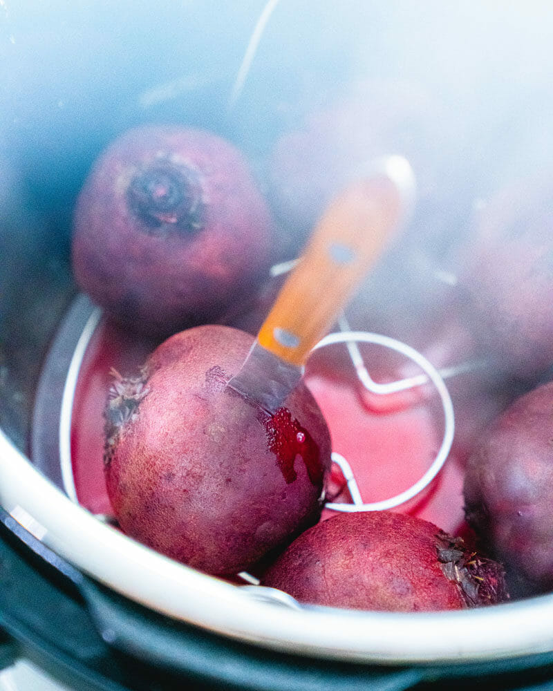 Beet with knife inserted in Instant Pot