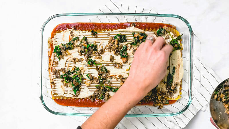 Layering dairy free lasagna