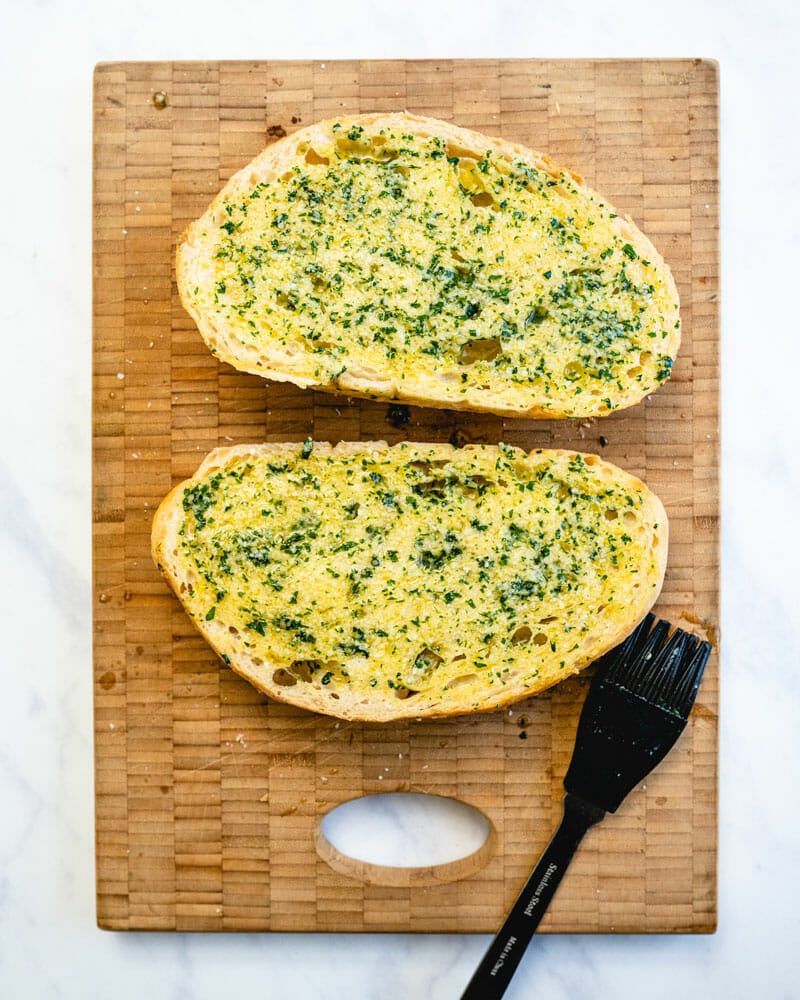 Step 2: Brush the cut sides with garlic butter