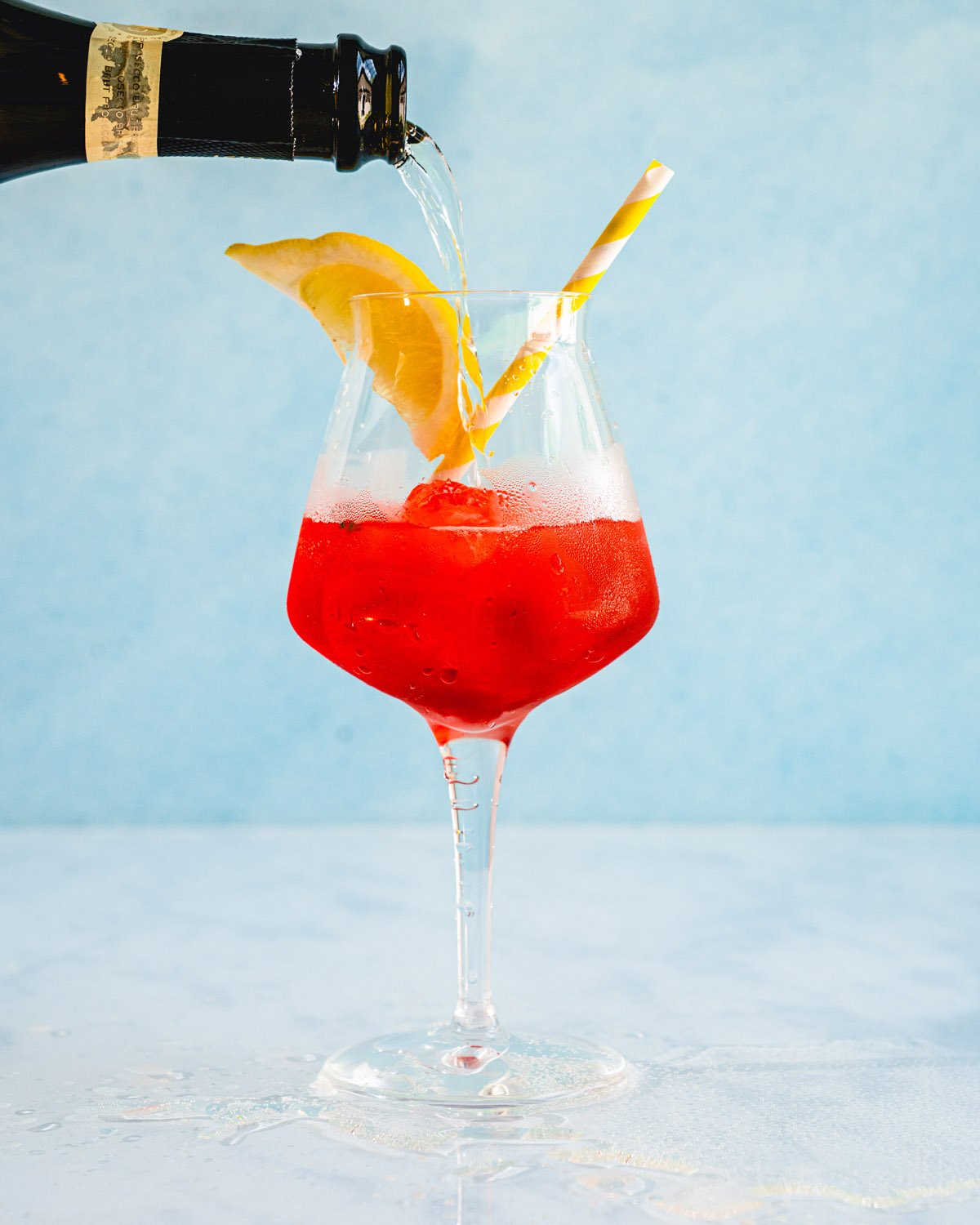 Campari spritz pouring prosecco
