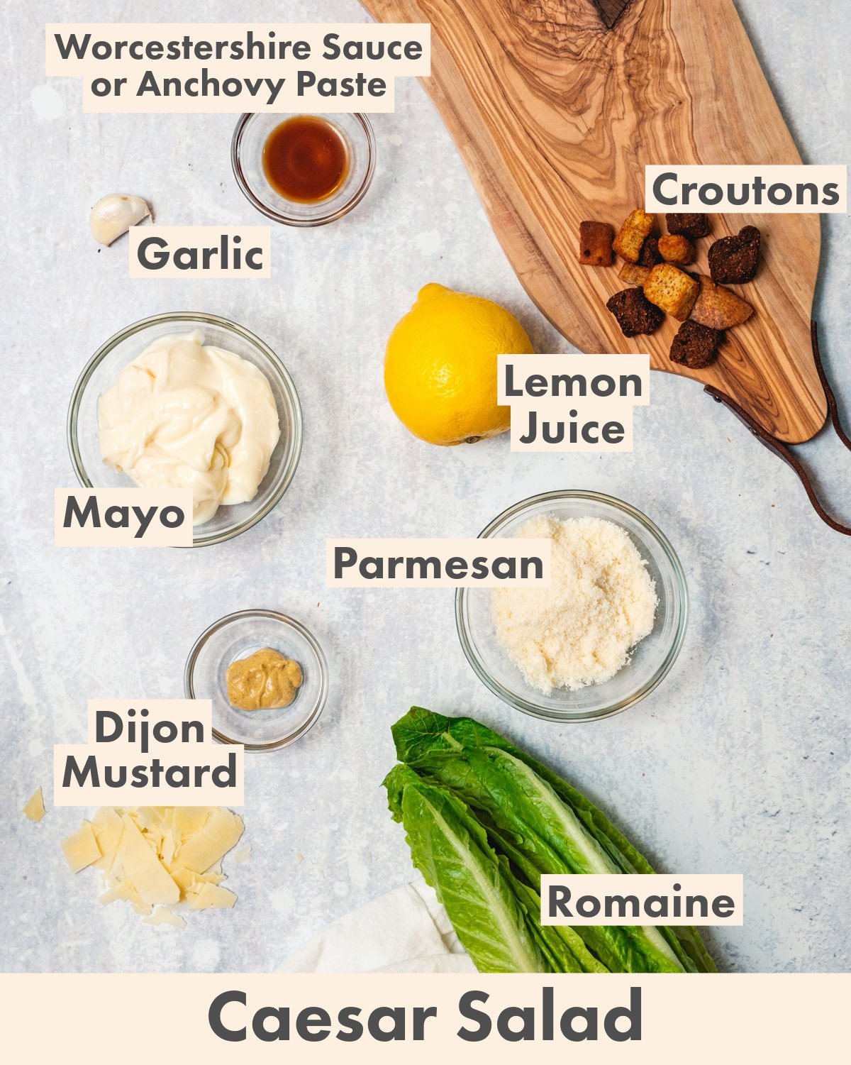 Caesar Salad Ingredients: Mayo, garlic, Parmesan cheese, Dijon mustard, lemon juice, anchovy paste or Worcestershire sauce, croutons, Romaine lettuce.