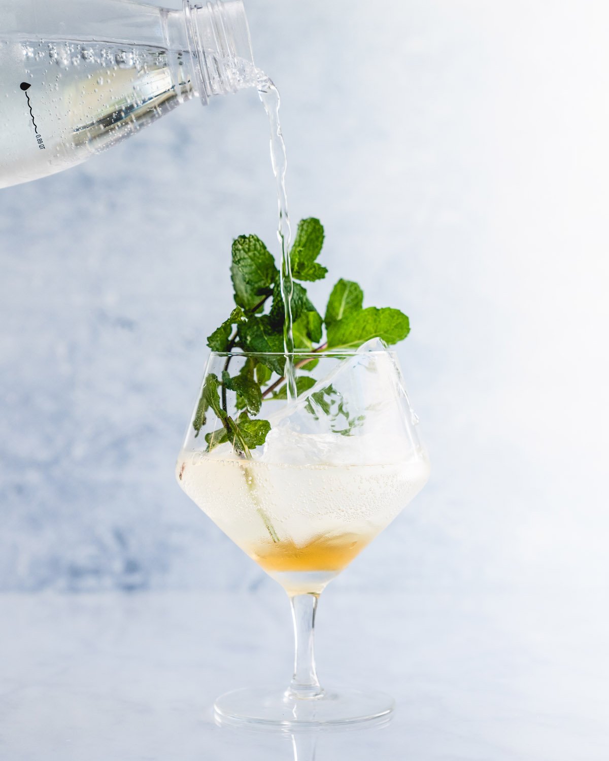 Step 2: Add soda water and garnish with mint.