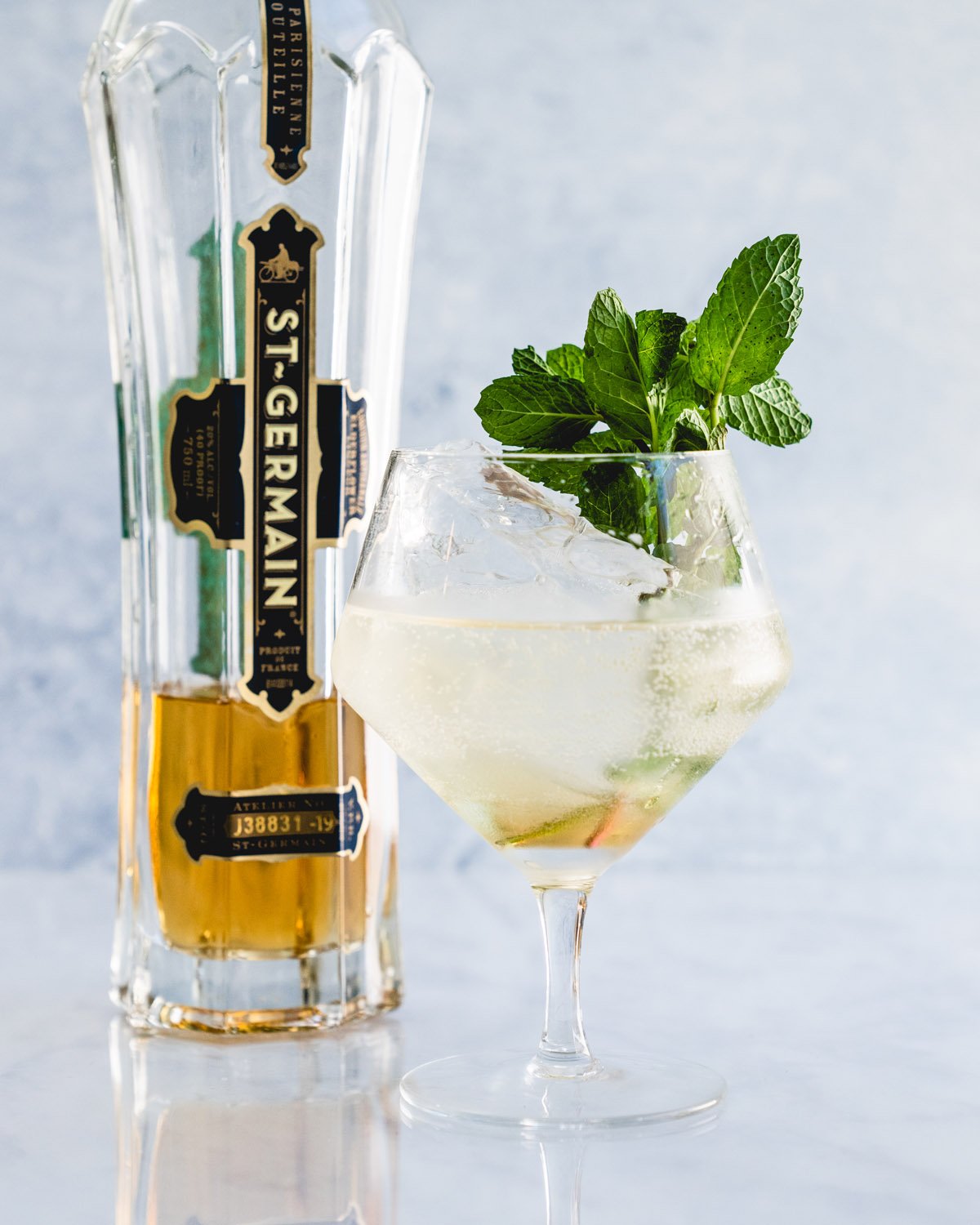 Hugo Spritz cocktail with mint garnish.