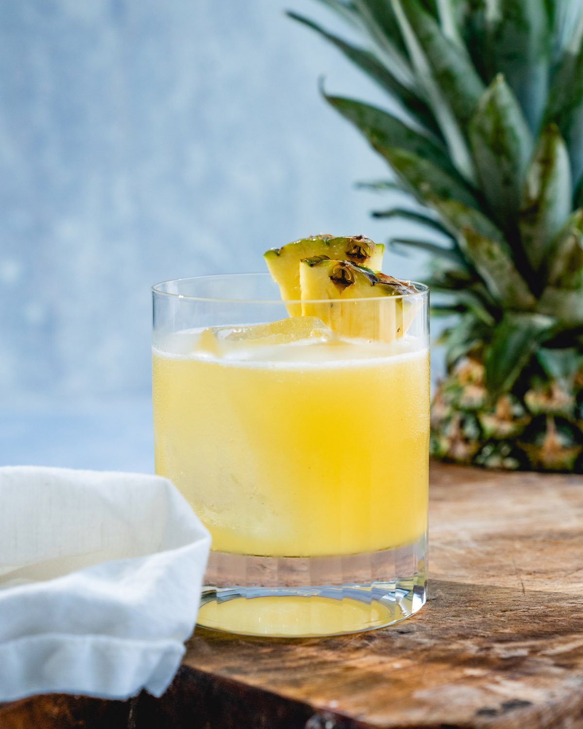 Pineapple Margarita in rocks glass with pineapple garnish.