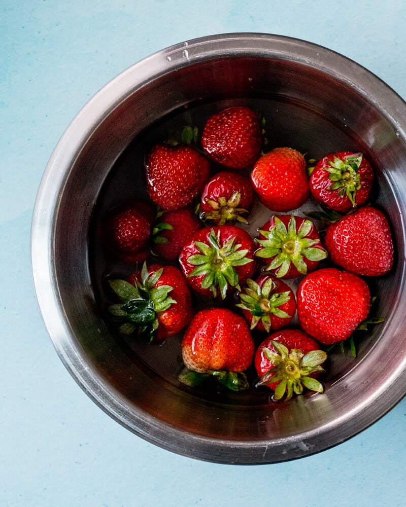 Step 1: Clean the strawberries.