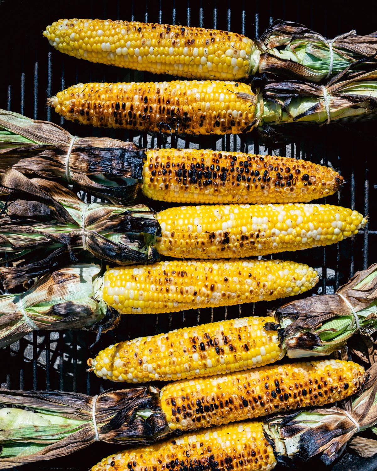 Above view of corn on a grill.