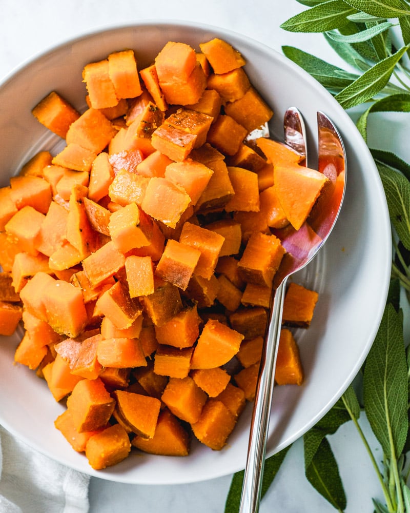 Boiling sweet potatoes, bowl of boiled sweet potatoes with spoon