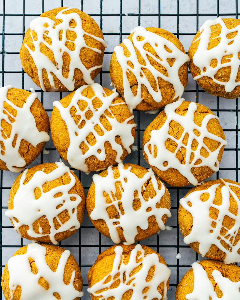 Pumpkin cookies with powdered sugar icing
