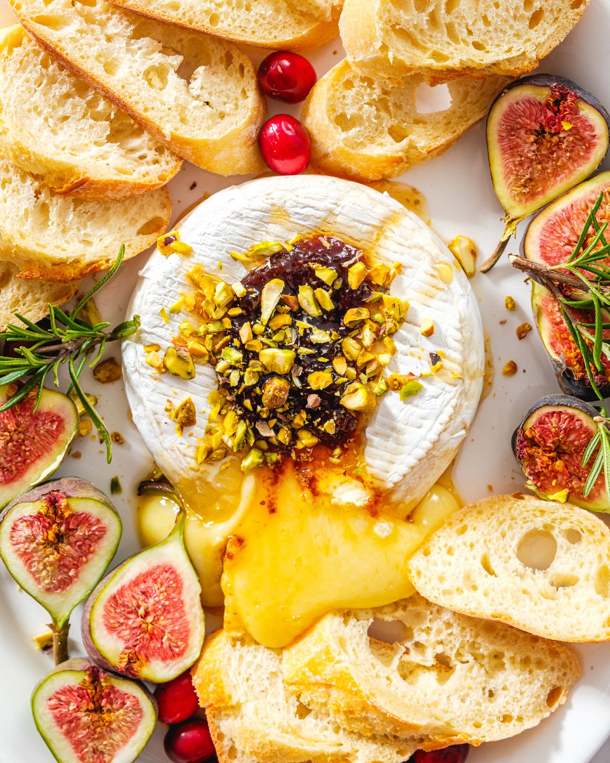 Baked Brie with crostini, figs and cranberries