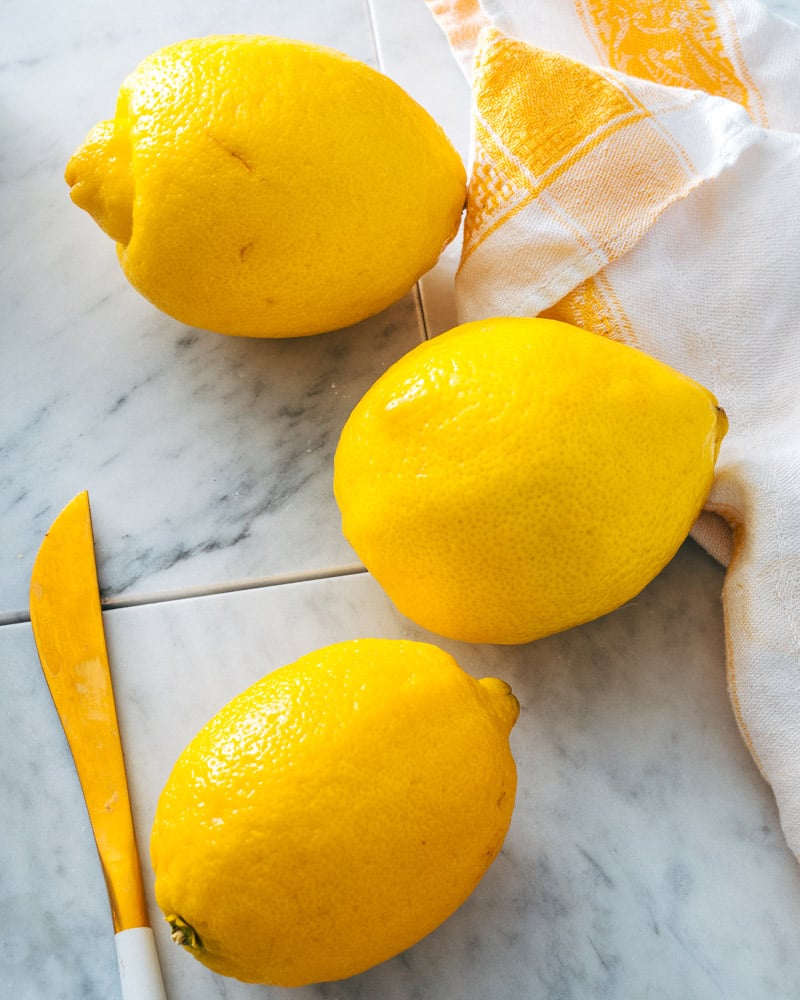 Lemons on marble surface. 