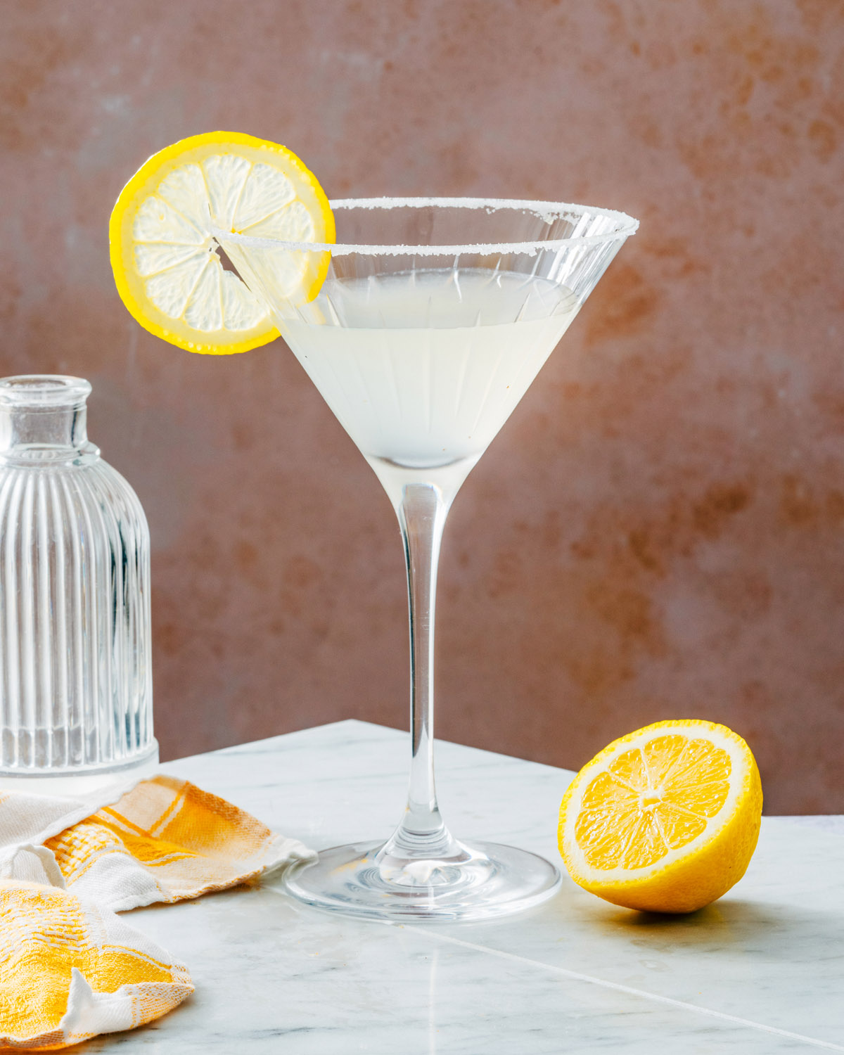 Lemon drop martini with lemon garnish.