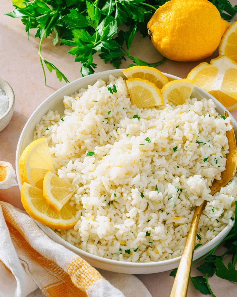 Lemon rice in serving bowl with spoon.