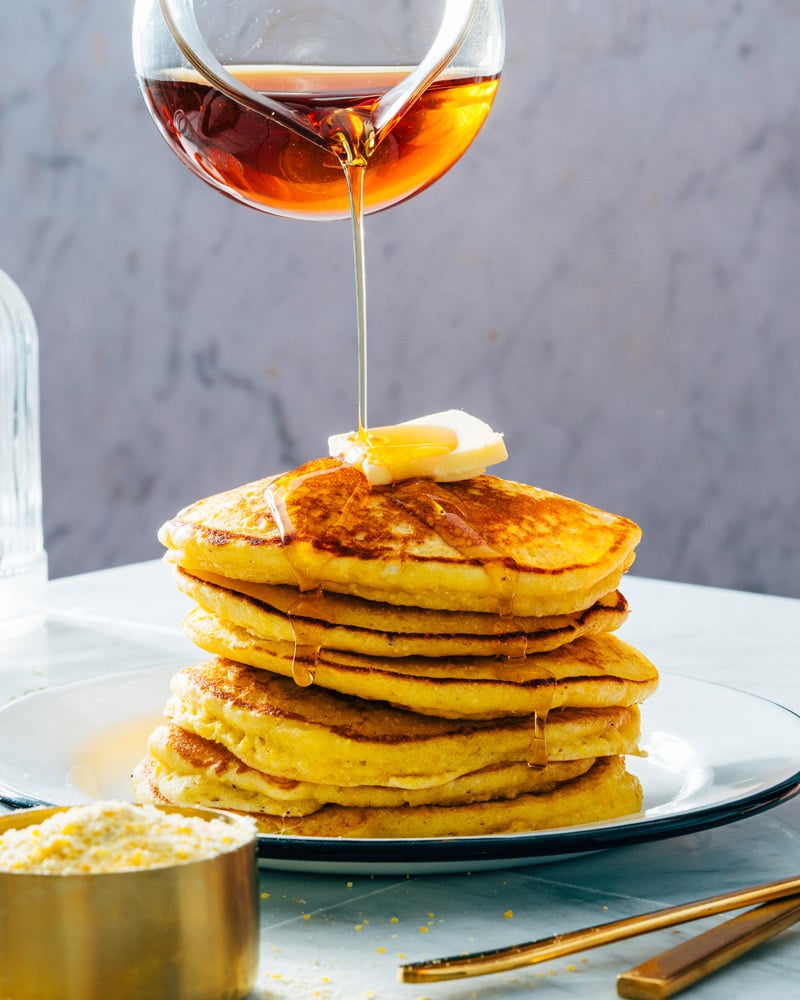 Syrup pouring over pancakes