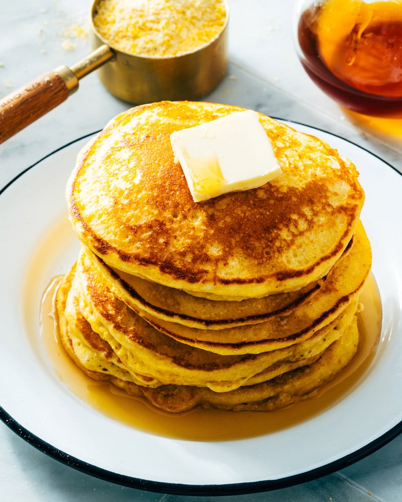 Cornmeal Pancakes with cornmeal in cup in background