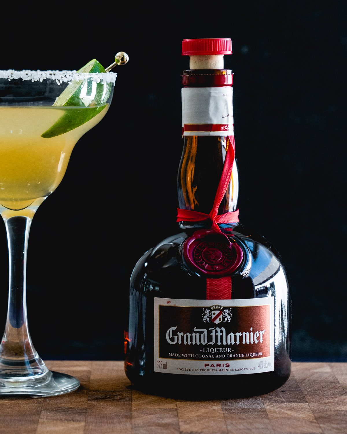 Grand Marnier bottle with Cadillac margarita.