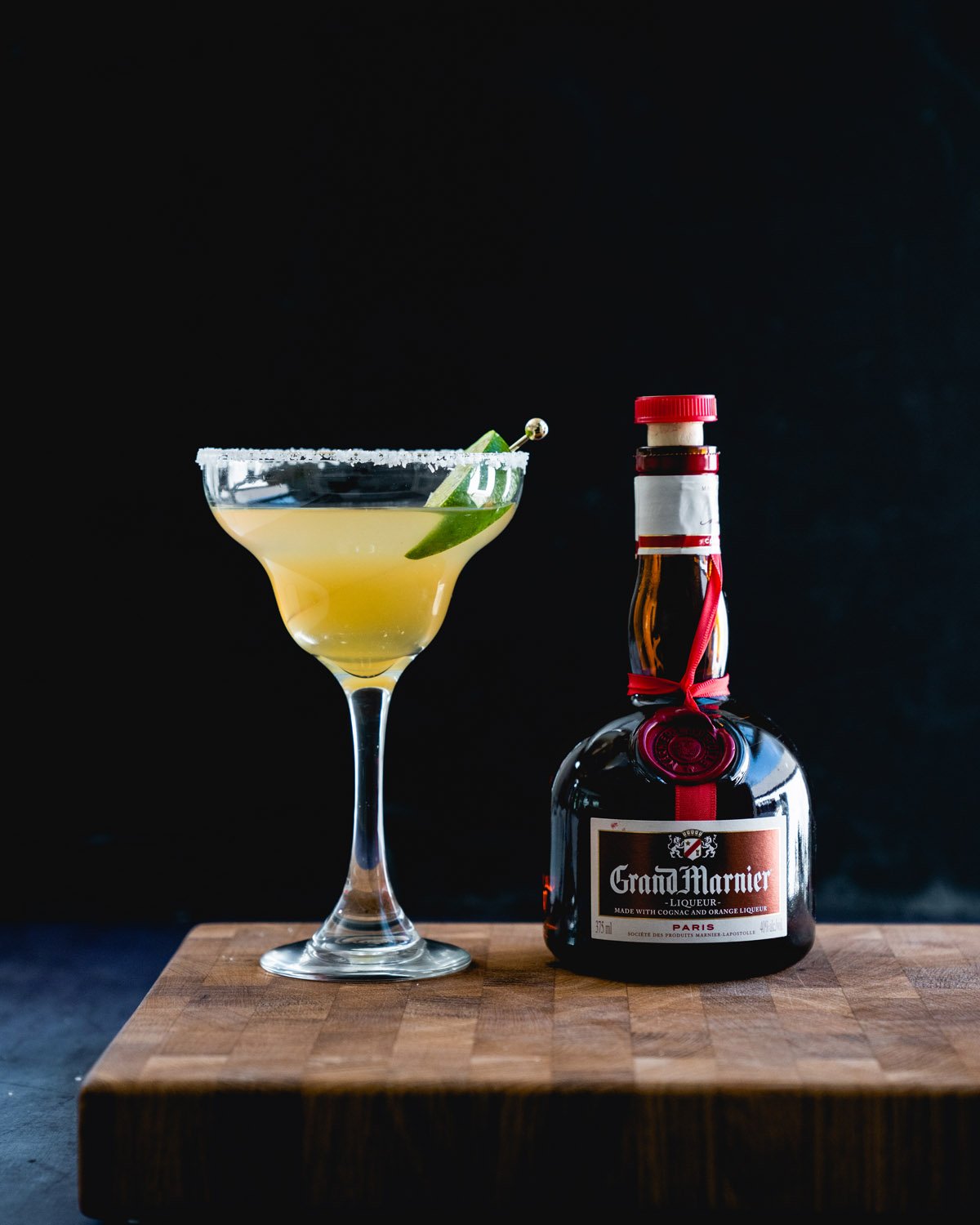Cadillac Margarita with Grand Marnier bottle.