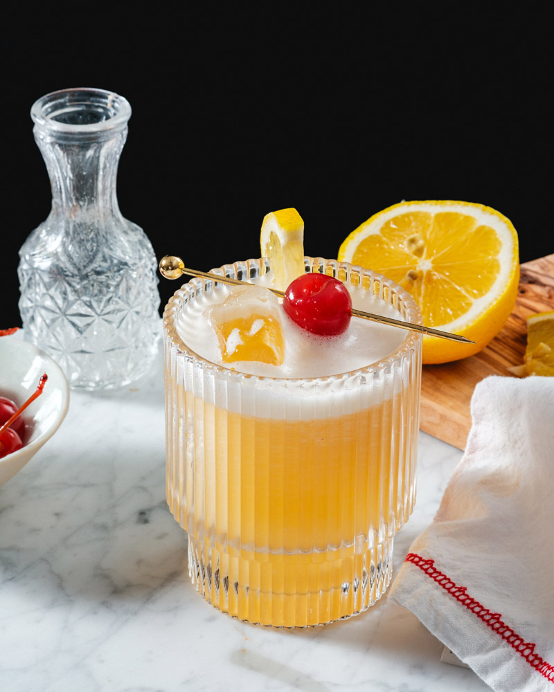How to make a rum sour cocktail recipe with lemon half