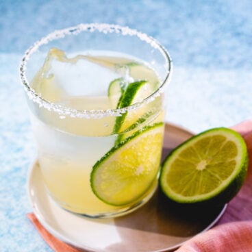 Virgin Margarita with lime garnishes and salt rim.