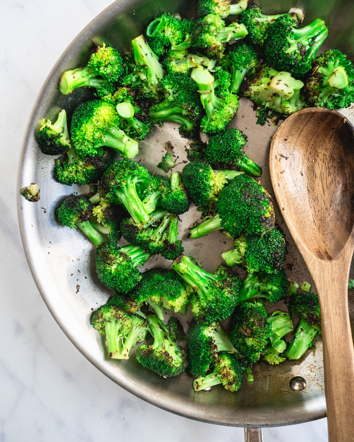 Sauteed broccoli in pan.