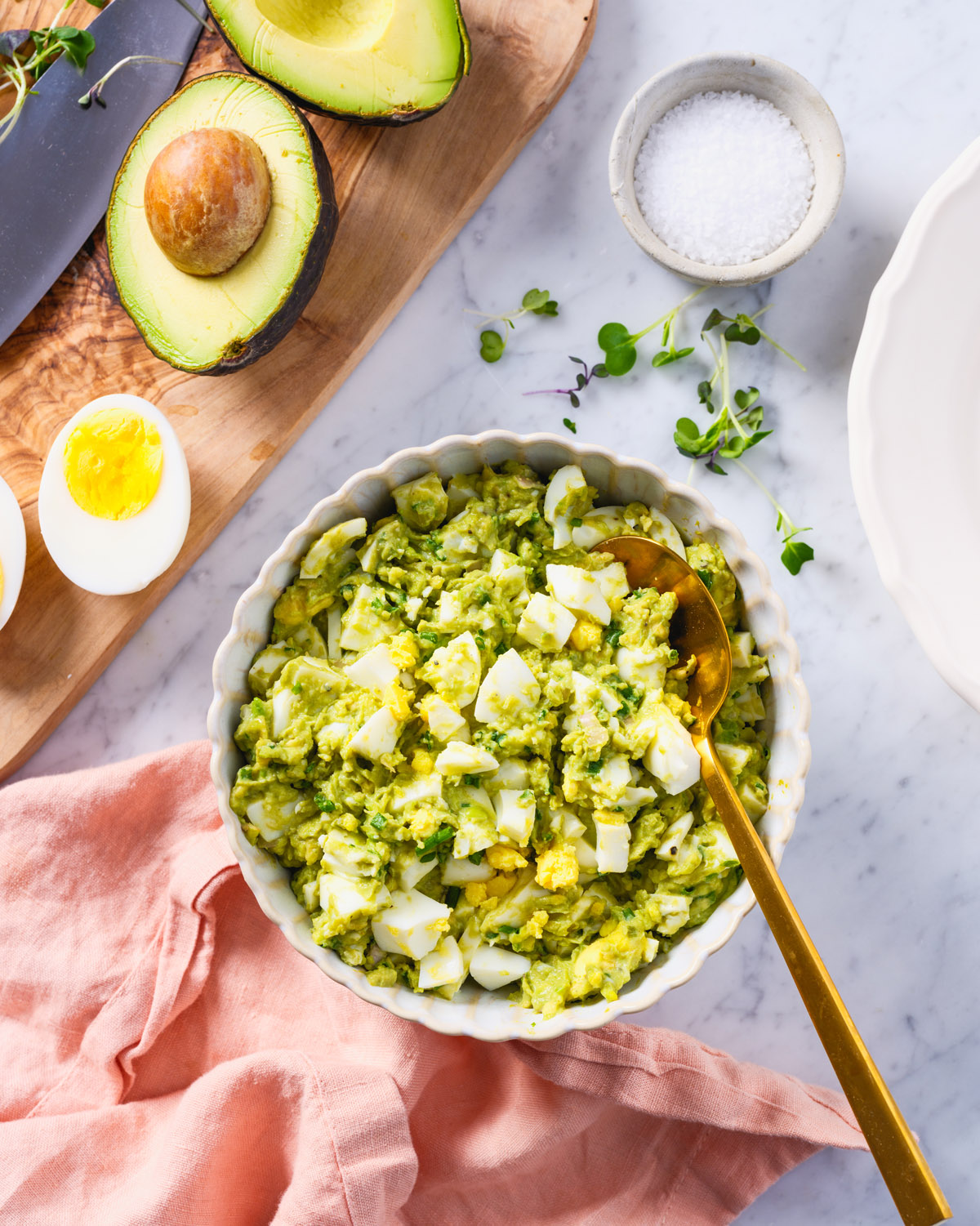 Avocado Egg Salad in a bowl with hard boiled eggs