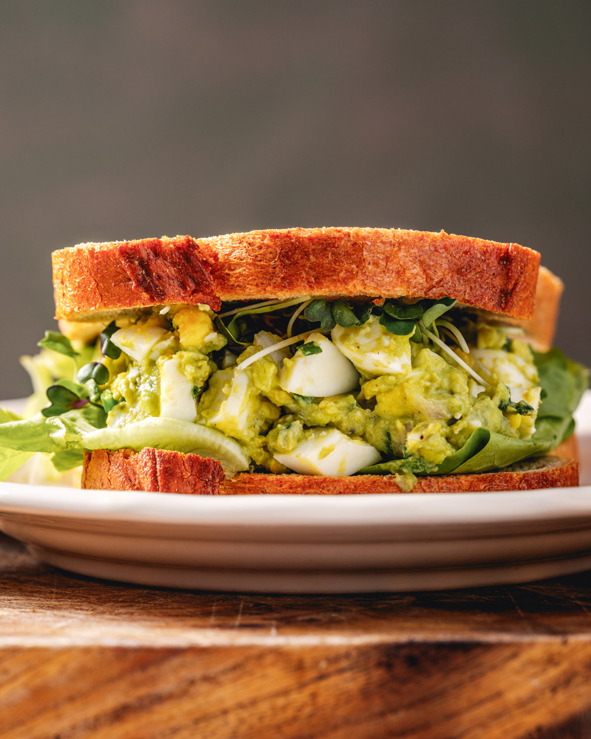 Avocado Egg Salad Sandwich on plate.