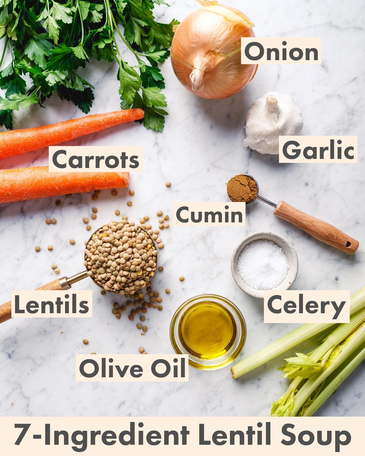 Ingredients for lentil soup: lentils, olive oil, cumin, celery, carrots, garlic, and onion.