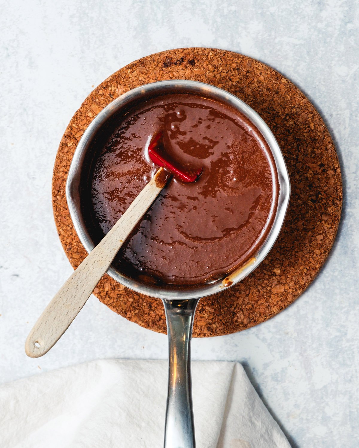 Saucepan with melted chocolate and peanut butter.