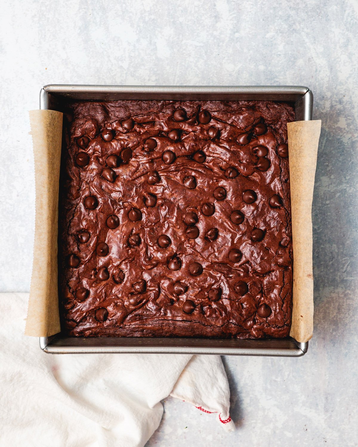 Baked olive oil brownies (dairy free) in pan.