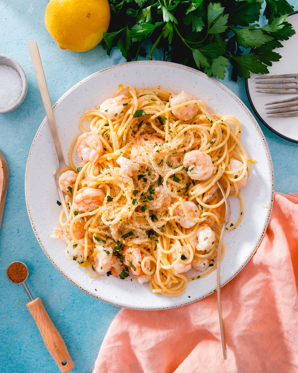 Lemon garlic shrimp pasta recipe with Old Bay, lemons, and parsley.