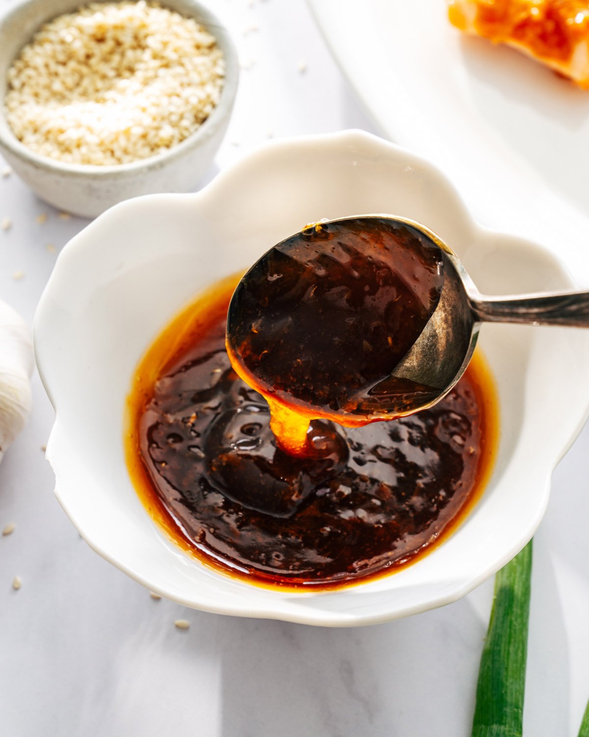 Honey Garlic Sauce with spoon in bowl.