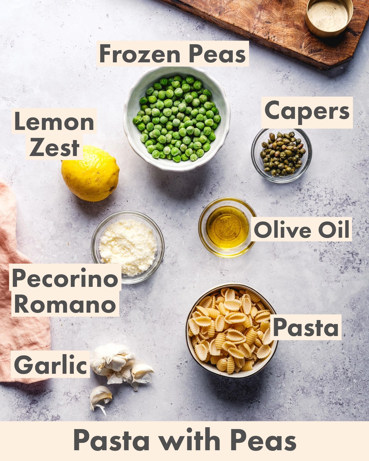 Ingredients for pasta with peas: frozen peas, lemon zest, capers, olive oil, Pecorino Romano cheese, garlic and pasta. 