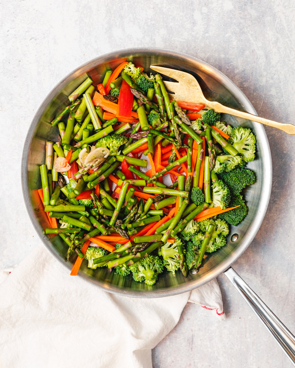 Shrimp primavera step 1: Veggies in pan.