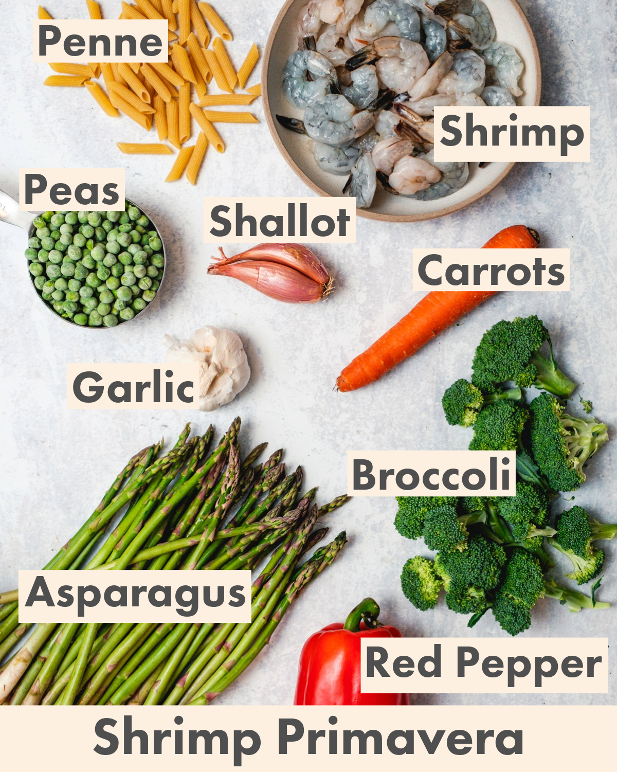 Shrimp primavera ingredients: pasta, shrimp, peas, shallot, carrots, garlic, asparagus, broccoli, red pepper.