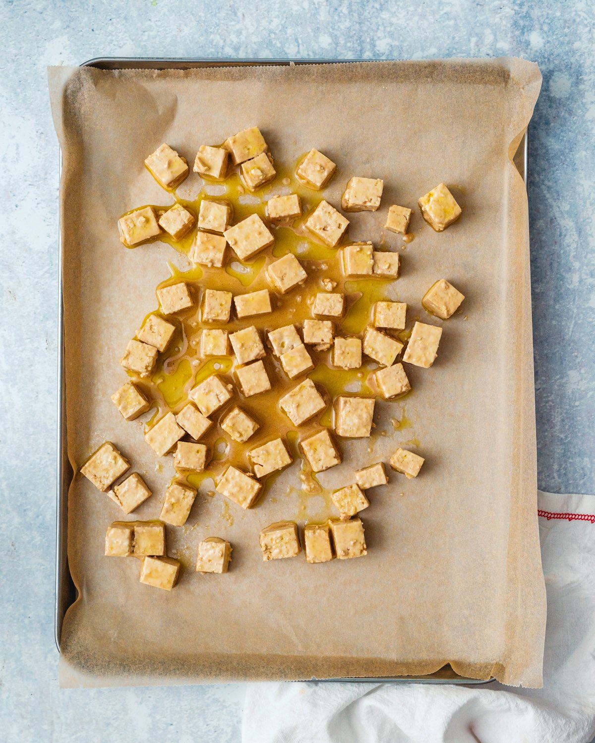 Step 3: Place the tofu on a parchment lined baking sheet.
