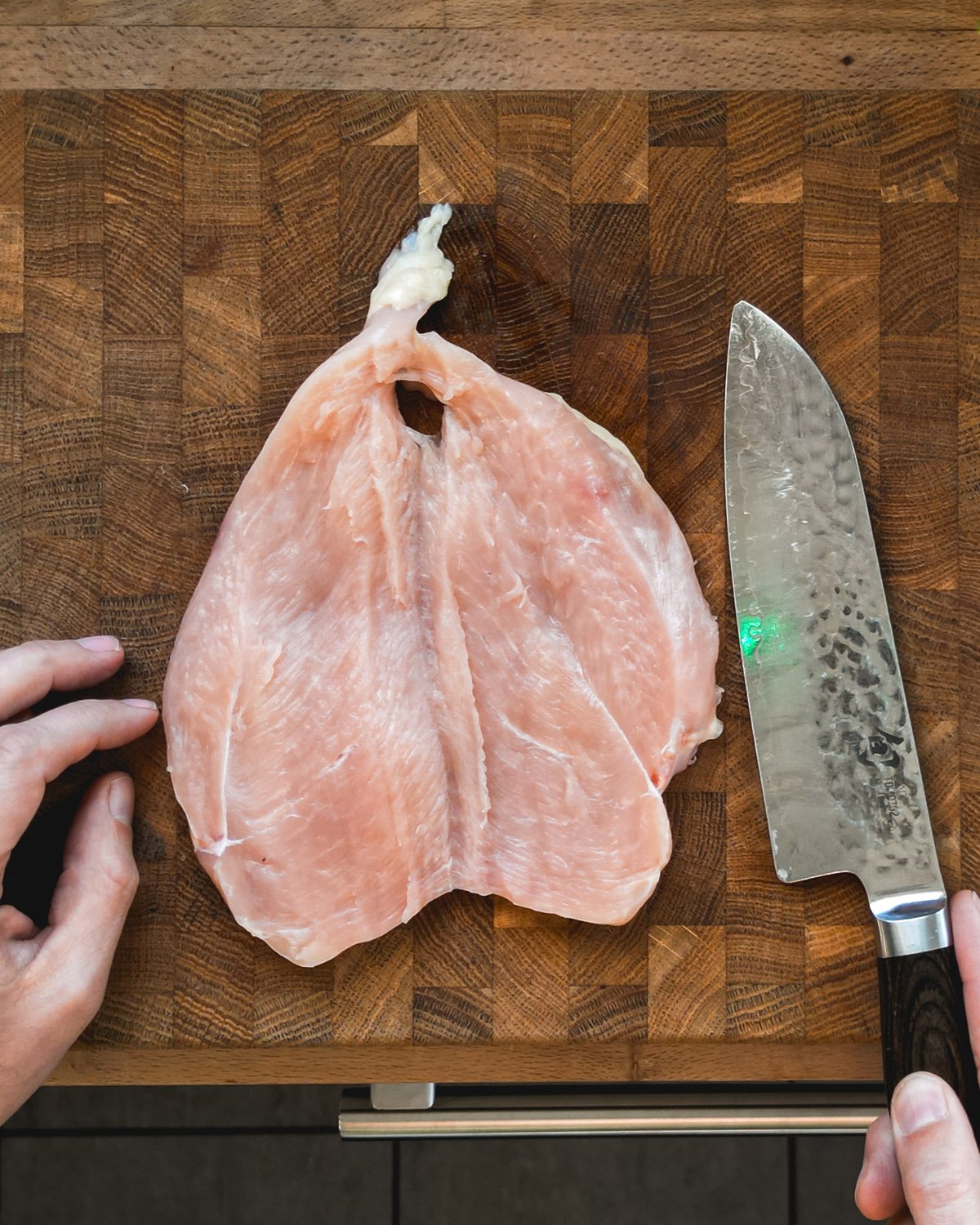 Grilled chicken step 1: Butterfly the chicken.