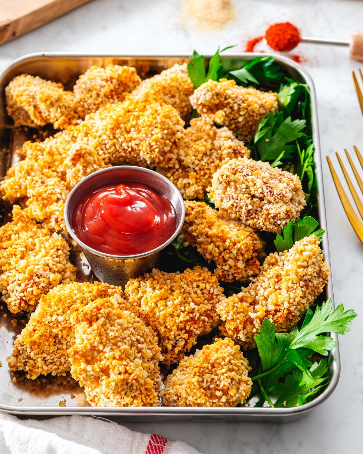Chicken Nuggets on a tray with ketchup.