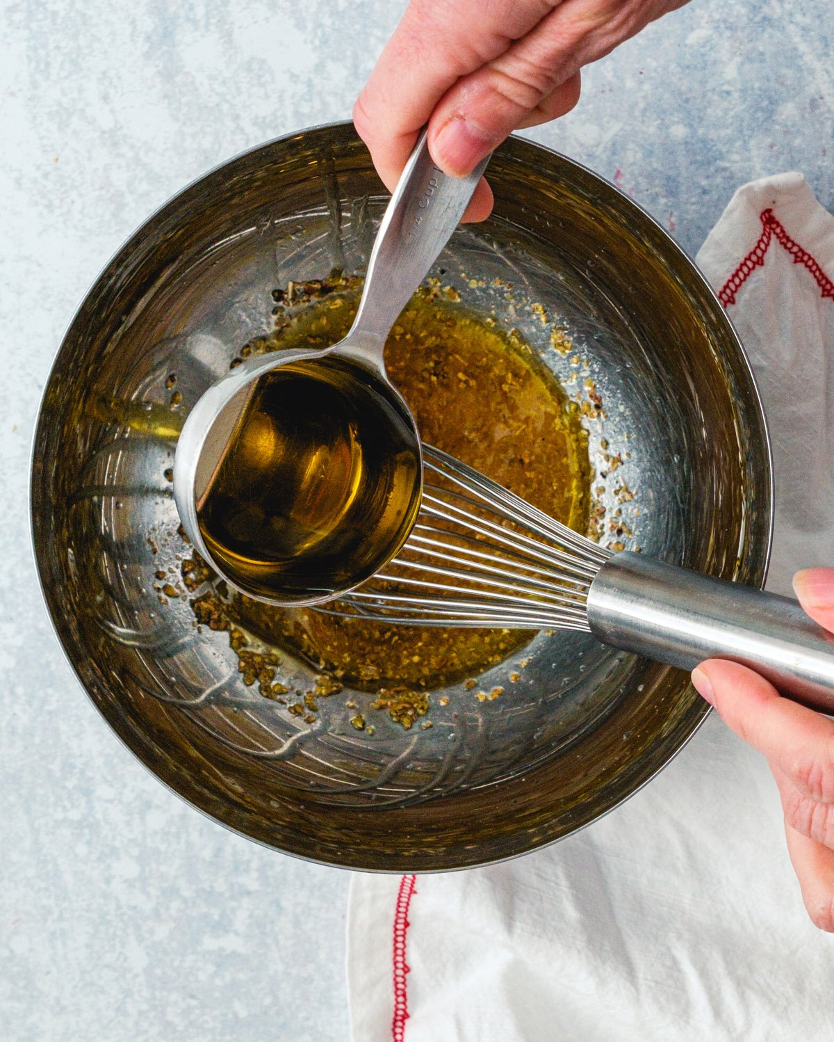 Step 2: Add the olive oil gradually. 